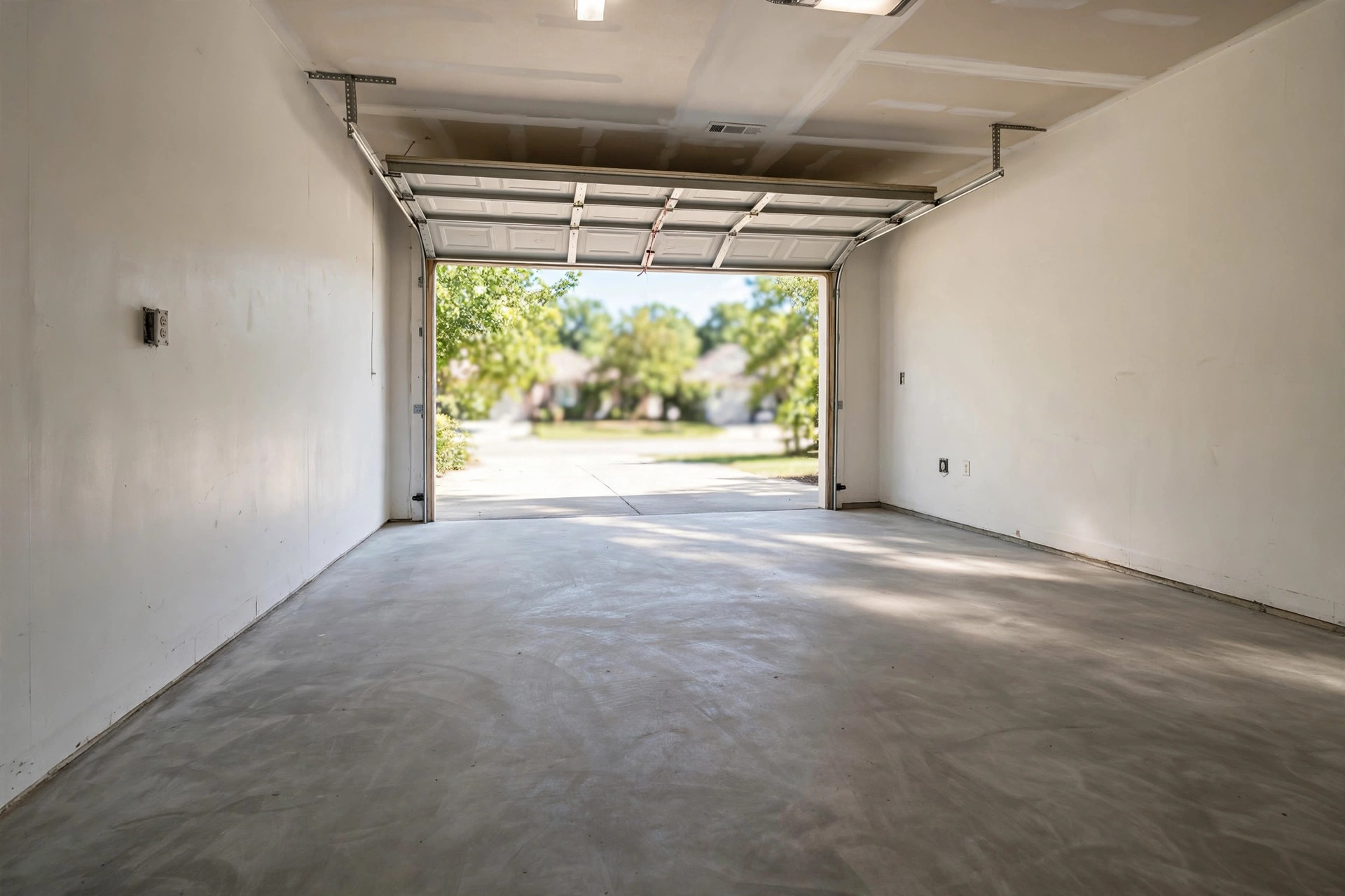 Clean empty garage after a junk removal crew hauled away old furniture and boxes