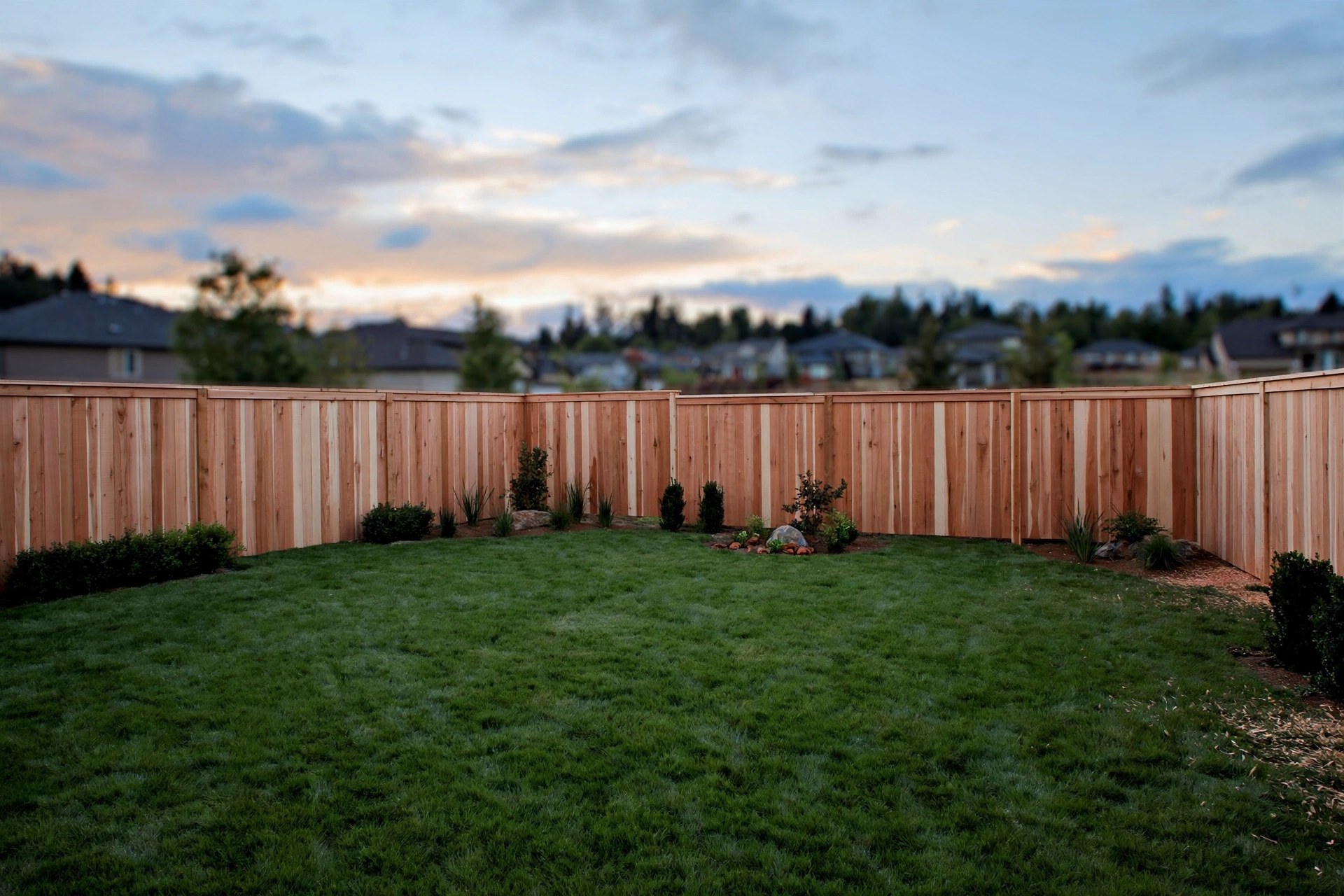 AI Chatbot for Fencing Companies: Answer Every Quote Request Newly installed cedar privacy fence around a suburban backyard at dusk